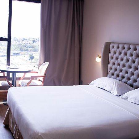 Ouro Minas Hotel Belo Horizonte, Dolce By Wyndham Exterior foto A bedroom at the hotel