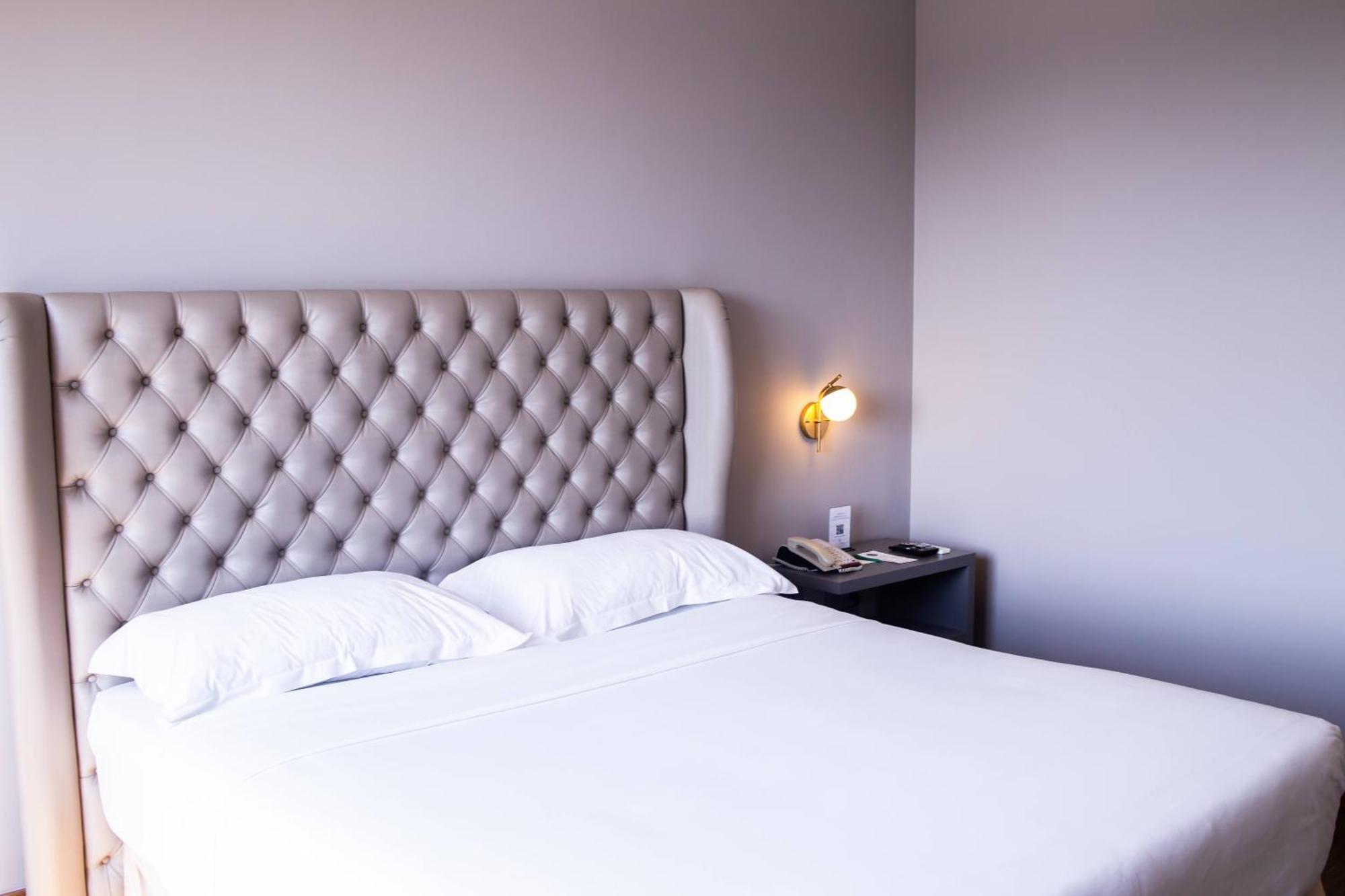 Ouro Minas Hotel Belo Horizonte, Dolce By Wyndham Exterior foto A bedroom at the hotel